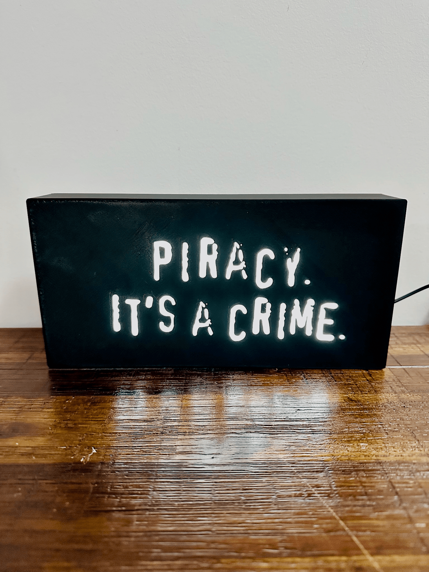 “Piracy. It's a crime” - infamous anti-piracy slogan - light up sign - USB Powered