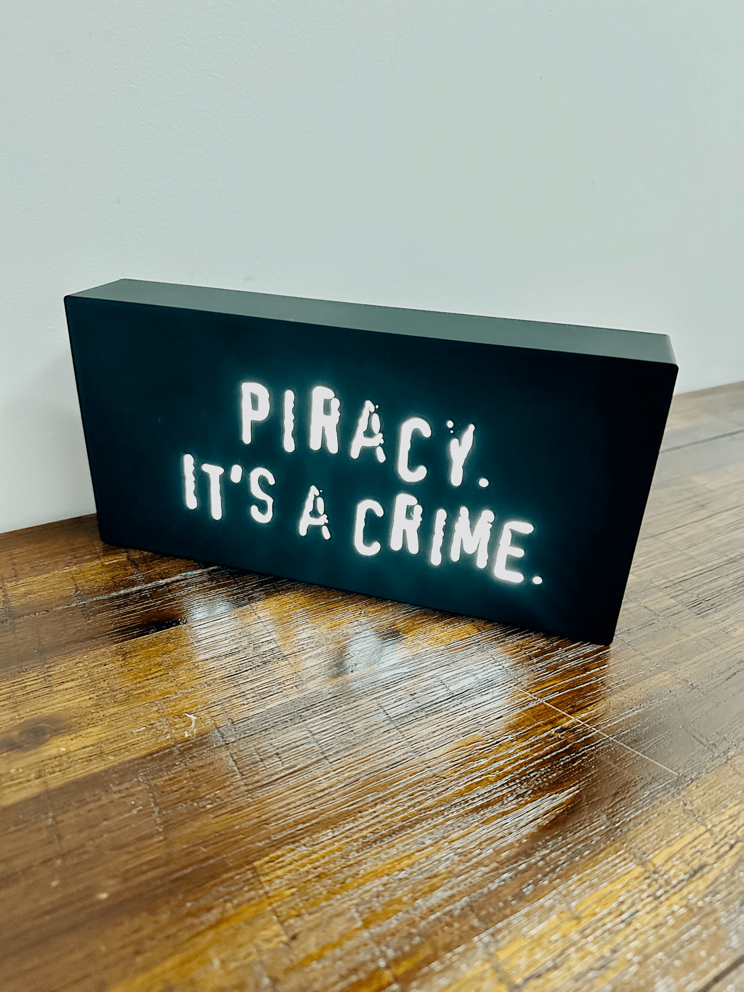 “Piracy. It's a crime” - infamous anti-piracy slogan - light up sign - USB Powered