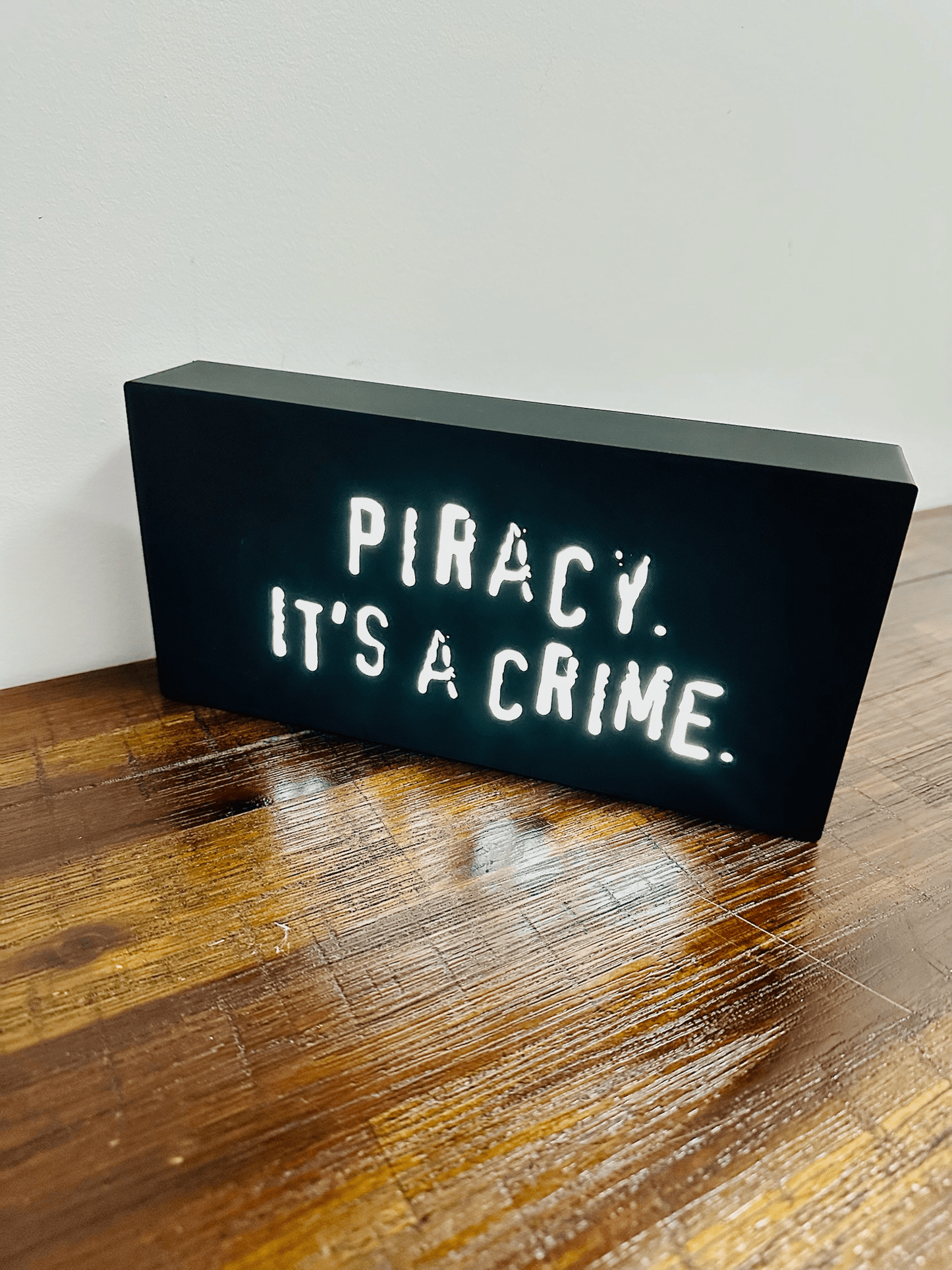 “Piracy. It's a crime” - infamous anti-piracy slogan - light up sign - USB Powered