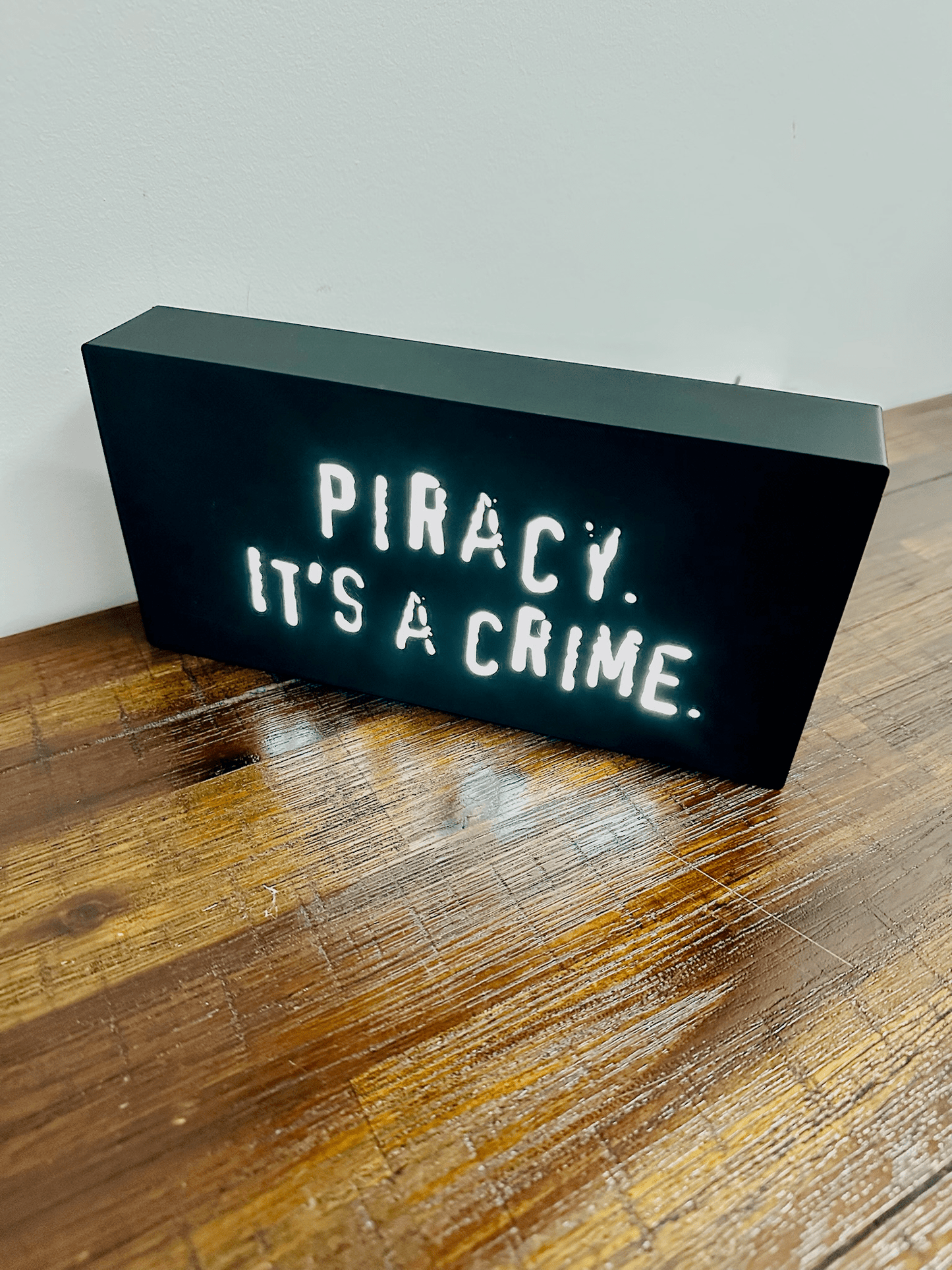 “Piracy. It's a crime” - infamous anti-piracy slogan - light up sign - USB Powered
