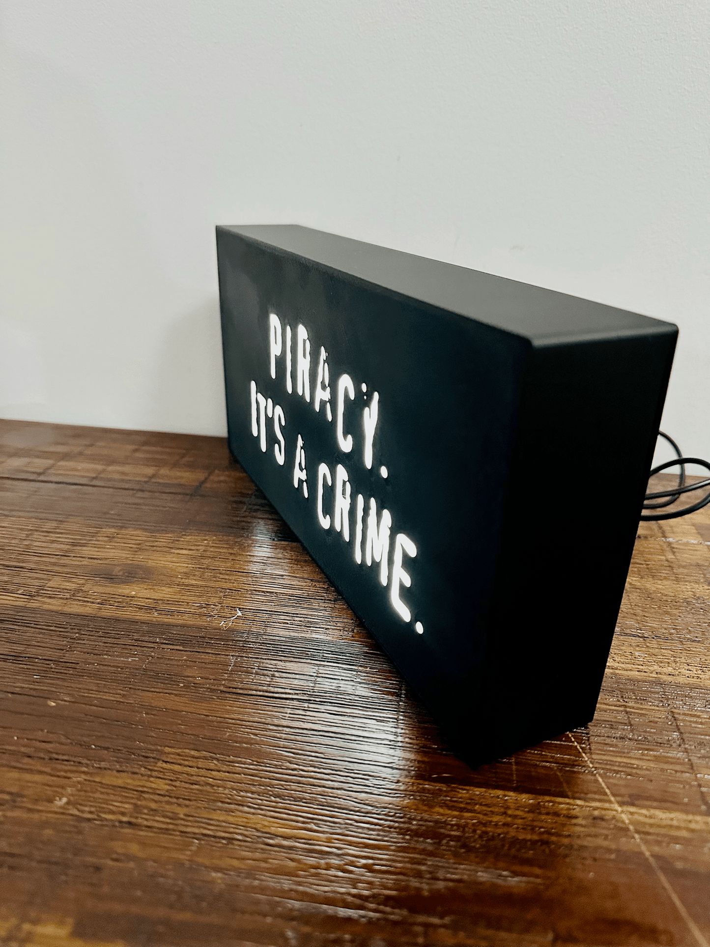 “Piracy. It's a crime” - infamous anti-piracy slogan - light up sign - USB Powered