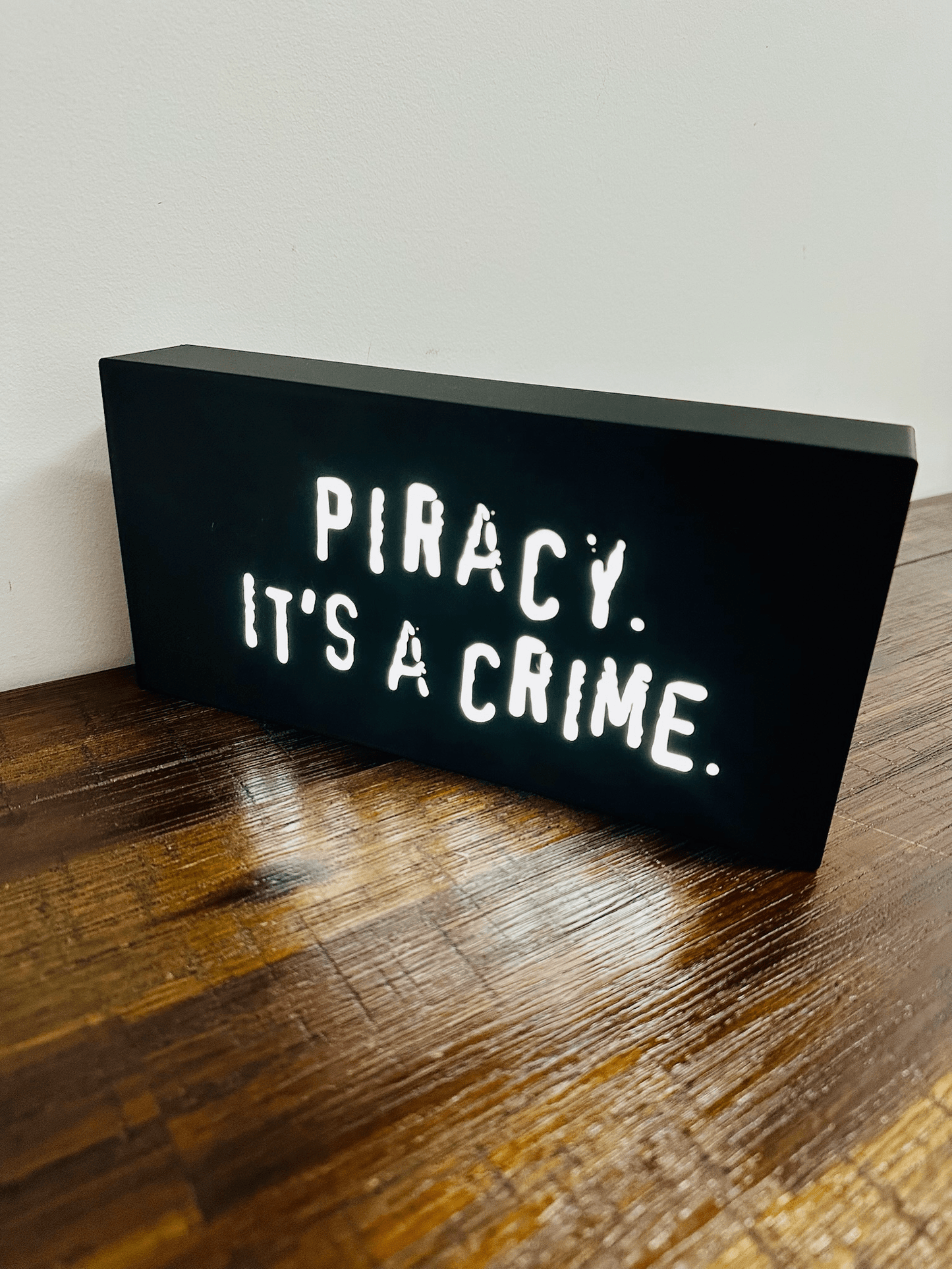 “Piracy. It's a crime” - infamous anti-piracy slogan - light up sign - USB Powered