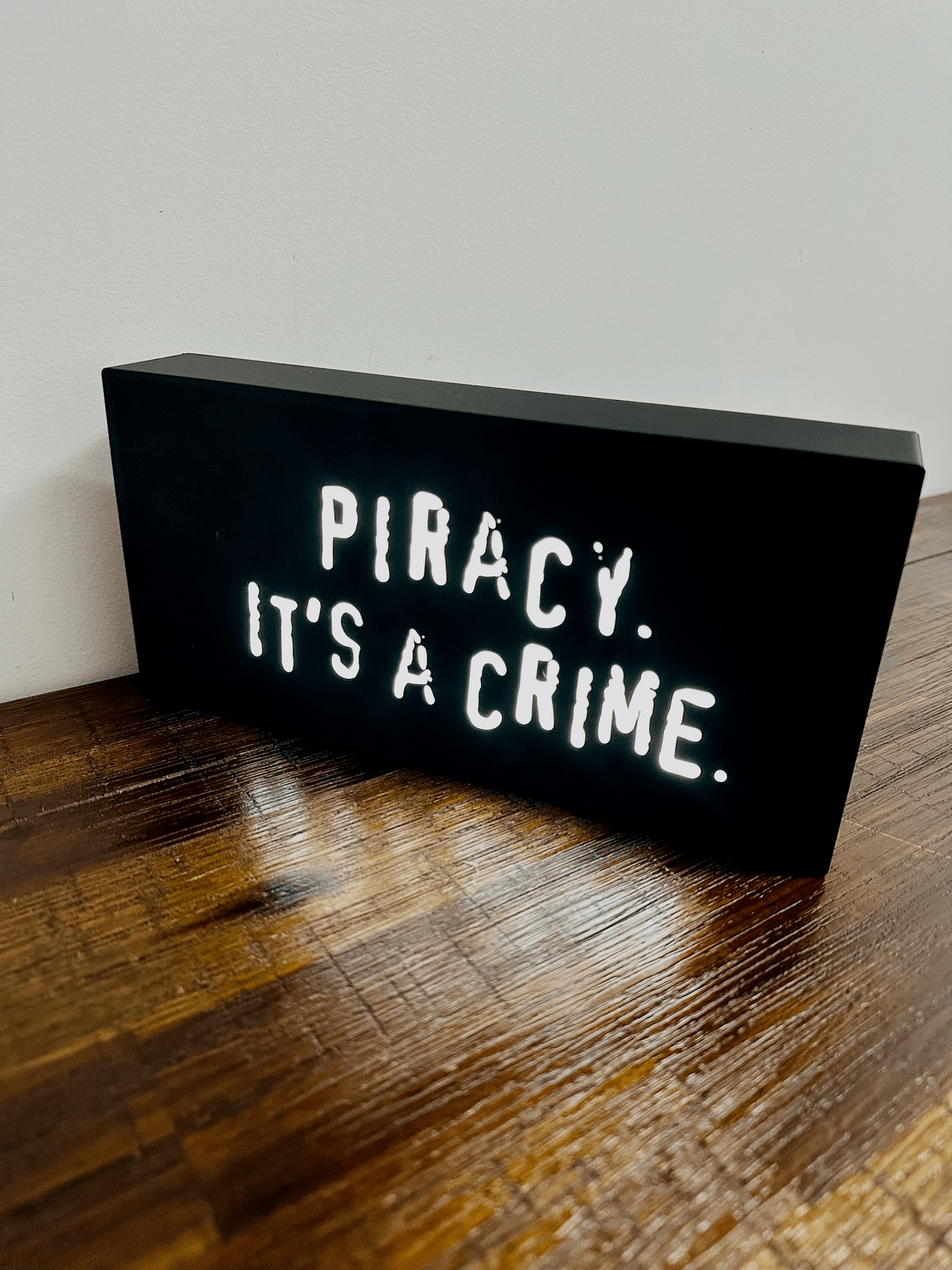 “Piracy. It's a crime” - infamous anti-piracy slogan - light up sign - USB Powered