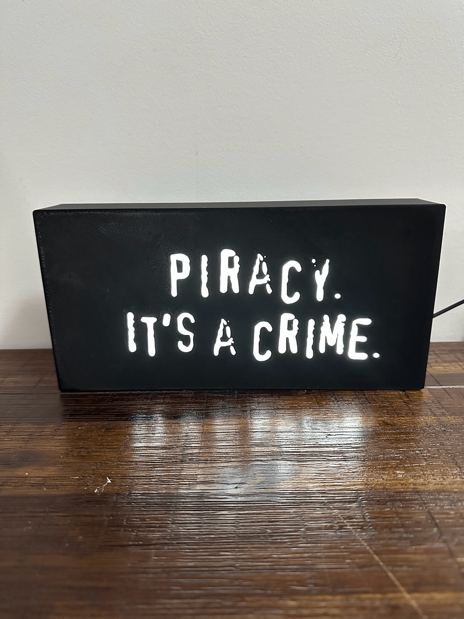 “Piracy. It's a crime” - infamous anti-piracy slogan - light up sign - USB Powered