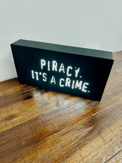 “Piracy. It's a crime” - infamous anti-piracy slogan - light up sign - USB Powered