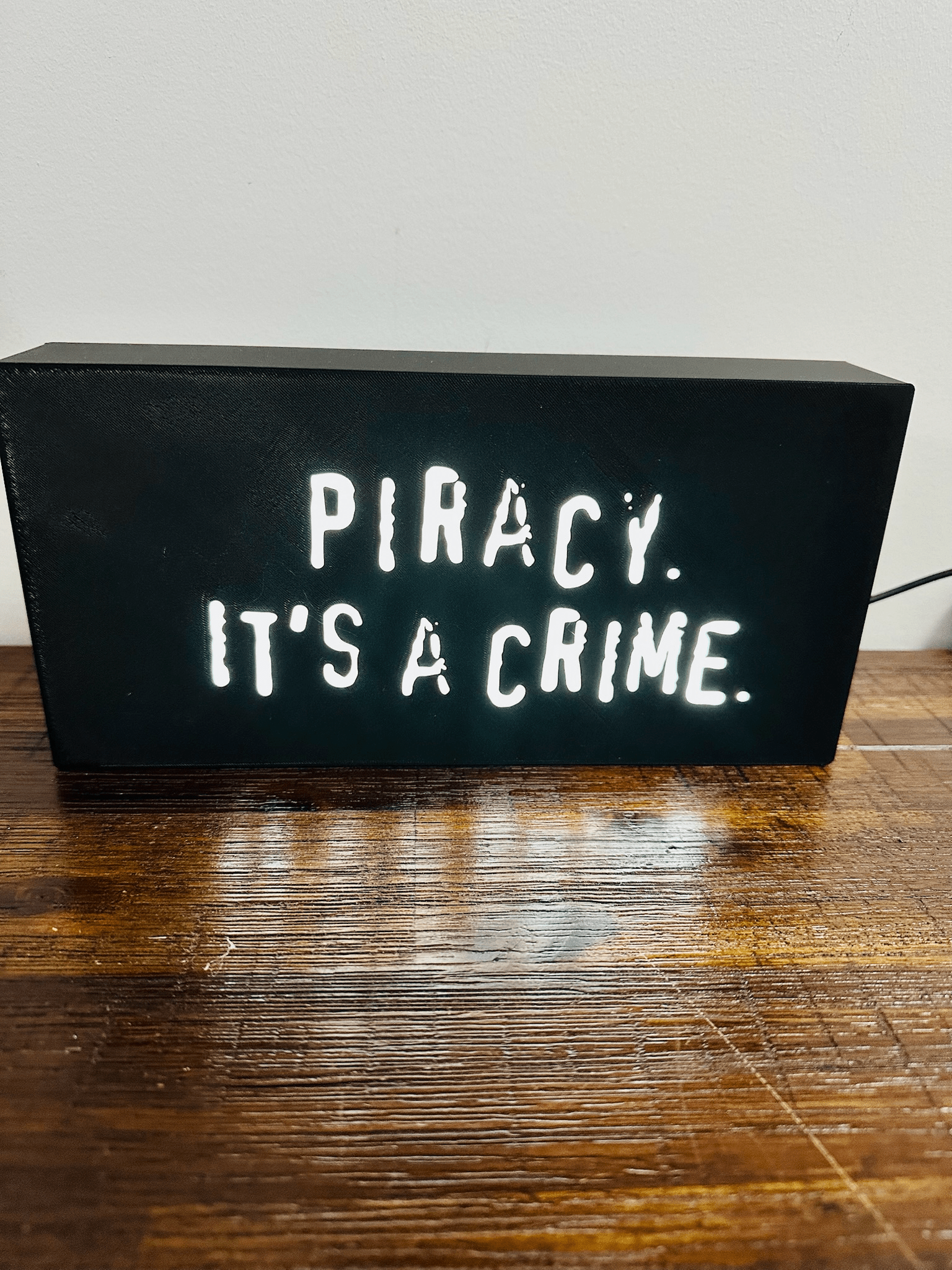 “Piracy. It's a crime” - infamous anti-piracy slogan - light up sign - USB Powered