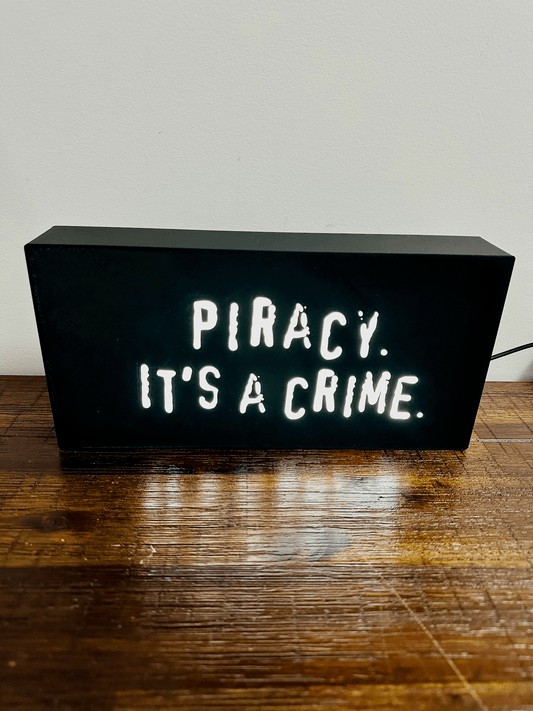 “Piracy. It's a crime” - infamous anti-piracy slogan - light up sign - USB Powered